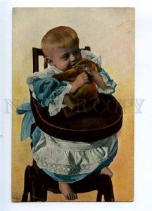 234466 Little Boy in HIGH CHAIR & TEDDY BEAR Vintage postcard