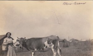 RPPC Postcard Woman Holding Bucket Leading Cow by Rope