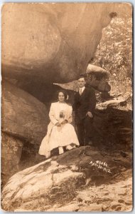 Man and Woman Stand Under Large Boulder from Wedding - 1912 - Vintage Postcard