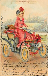 MIT ROSENDUFT-WOMAN DRIVING AUTOMOBILE COVERED WITH ROSES~1904 ARTIST POSTCARD