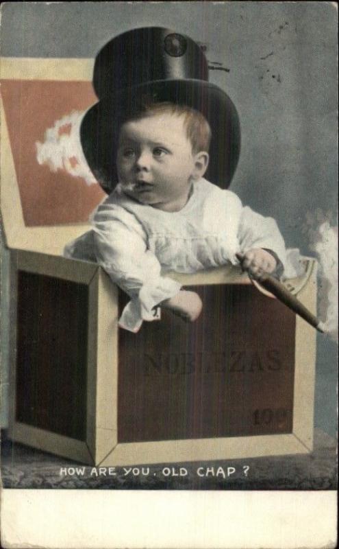Baby Boy in Box Wearing Top Hat Smoking Cigar c1910 Postcard