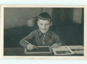 rppc c1910 BOY WRITING ON ANTIQUE SCHOOL SLATE AC8880