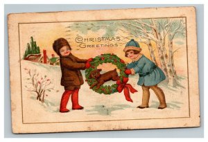 Vintage 1926 Winsch Back Christmas Postcard Puppy Jumps Thru Wreath Cute Kids