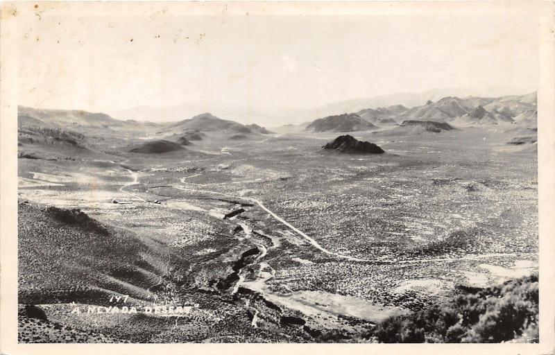 Nevada~Desert Scene~Hills Acorss Barren Land~1950s RPPC Real Photo Postcard