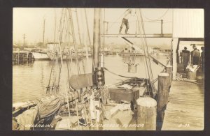 RPPC PENSACOLA FLORIDA FIWHING BOAT UNLOADING FISH REAL PHOTO POSTCARD