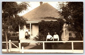 RPPC Post Card Man & Woman on Front yard & Children on Front Porch of House