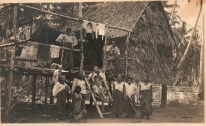 Vintage Postcard 1910's Family Outside of Hay Hut Home Photo RPPC