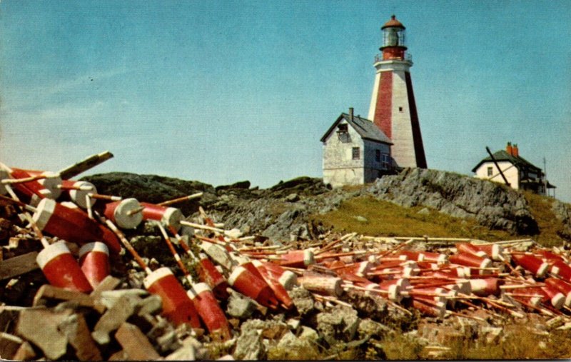 Canada Nova Scotia Yarmouth Lighthouse With Lobster Pot Markers In Foreground