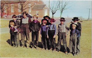 A Group of Amish Boys Hair is cut with a Bang in Front