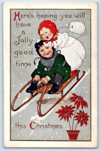 1915 Christmas Children Sledding Snow Winter Poinsettia Flowers Pot Postcard