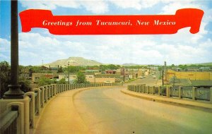 Tucumcari New Mexico 1960s Postcard Overpass to Downtown Stores Cars