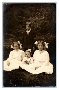 Vintage 1910's RPPC Postcard Portrait of Young Boy with Sisters in the Park