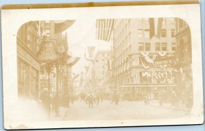 SOLIO RPPC June 9, 1912 street scene trolley patriotic flags long distance phone