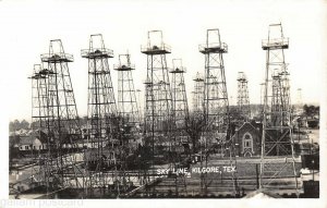  Kilgore Texas skyline Oil wells rigs downtown Rppc postcard 1930-40 R