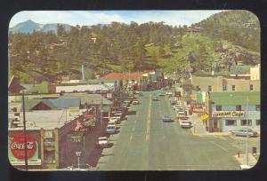 ESTES PARK COLORADO DOWNTOWN STREET SCENE COCA COLA SIGN VINTAGE POSTCARD