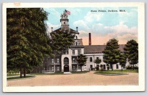 Jackson Michigan~State Prison Bldg Street View~US Flag~EC Kropp Vintage Postcard