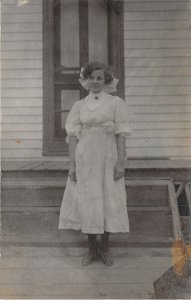 1909 RPPC Real Photo Postcard Pretty Girl Standing Porch Mitchell South Dakota