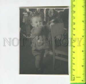 452176 USSR 1952 year child at the chair Christmas tree Belarus Minsk Old photo