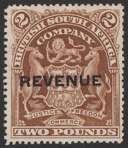 RHODESIA 1907 'REVENUE' on Arms £2 brown. Rare.