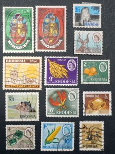RHODESIA  Small lot of 13 stamps,   used & MH