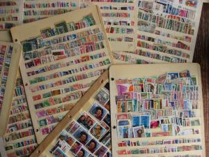 WW boxlot stamps haphazardly stuck into stock pages,no apparent order,what lurks