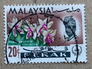 Perak 1965 20c Orchid, used. Scott 145, CV $0.25. SG 169