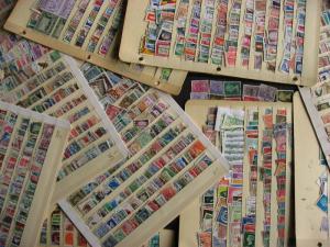 WW boxlot stamps haphazardly stuck into stock pages,no apparent order,what lurks