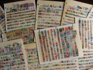 WW boxlot stamps haphazardly stuck into stock pages,no apparent order,what lurks