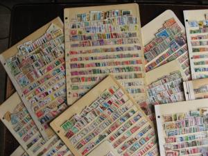 WW boxlot stamps haphazardly stuck into stock pages,no apparent order,what lurks