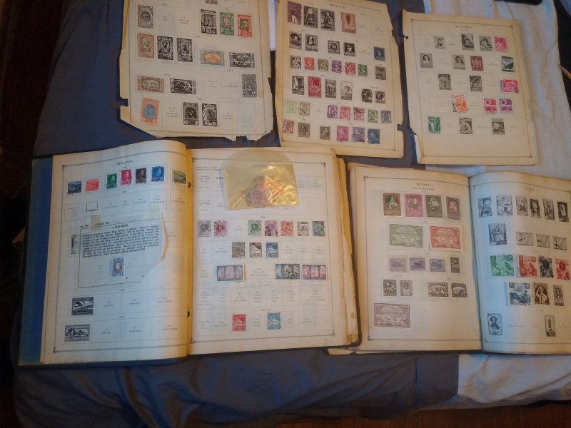 Two international junior postage stamp albums with 1000+ stamps inside