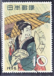 JAPAN SCOTT# 646  1958  10y  WOMAN WITH UMBRELLA   SEE SCAN