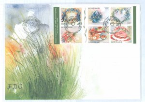 Finland 1149 2000 booklet pane of 6 floral wreaths and pastries on a cacheted, unaddressed FDC