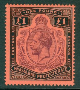 SG 98 Nyasaland £1 purple & black/red. Very lightly mounted mint