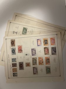 Collection of classic Ivory Coast stamps on old Scott pages