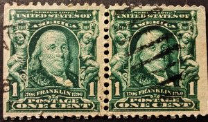 United States. A used horizontal postage pair of one-cent stamps from...