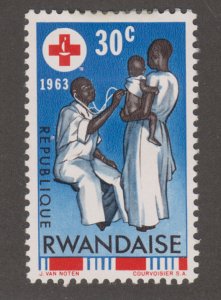 Rwanda 46 Physician examining infant 1963