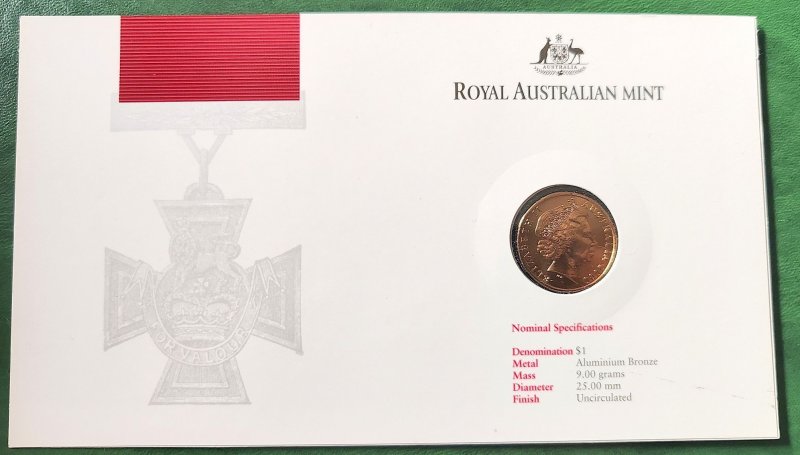 A postal envelope with a coin and postage stamps issued by Australia Post and...