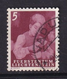 Liechtenstein  #247  used   1951  boy cutting bread  5rp