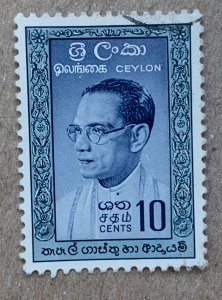 Ceylon 1961 10c Bandaranaike, dark temples, used. Scott 362a, CV $0.25. SG 471a