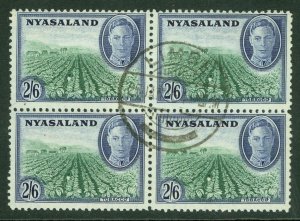 SG 154 Nyasaland 1945. 2/6 emerald & blue. Very fine used block of 4