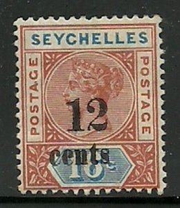 Album Treasures Seychelles  Scott # 23  12c on 16c Victoria Mint  Hinged