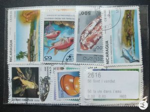 Animals , WW stamp accumulation, kiloware ,50 different used fish stamps