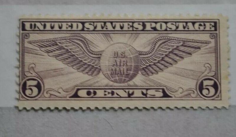 US C12 air mail stamp 5 cent winged globe unused