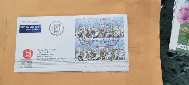 1986 SINGAPORE REGISTERED FDC TO ENGLAND  ON 25 COMMEMORATIVE STAMP ISSUE