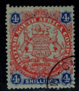 Rhodesia Scott 37 Used  4 Shilling coat of arms stamp, nicely centered