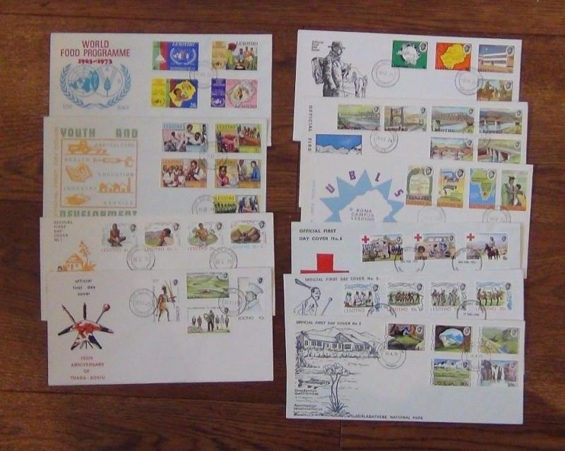 Lesotho FDC x 10 1973 1976 Red Cross Instruments UPU Bridges Food Siege Youth 