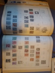 Two international junior postage stamp albums with 1000+ stamps inside