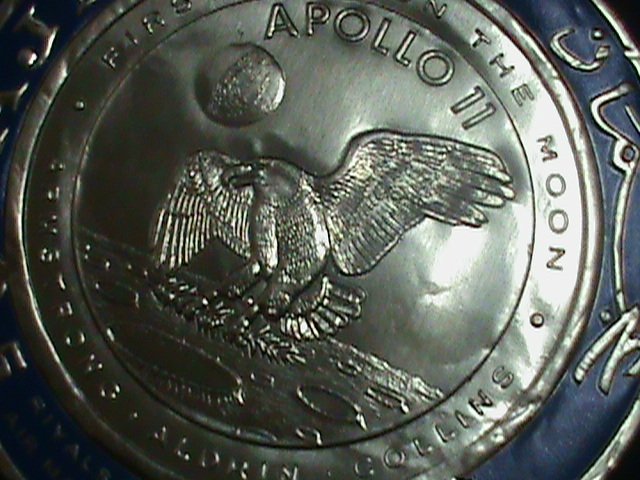 ​AJMAN-AIRMAIL-FIRST MAN ON THE MOON-APOLLO 11-ALUMINIUM REPLICA ROUND STAMP