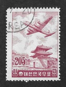 Korea Scott #C22 Used 205h DC-7 over East Gate Airmail Stamp 2019 CV $5.00