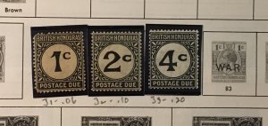 Collection of mint British Honduras stamps on Minkus pages